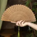 Natural green sandalwood folding fan with tassel, traditional Chinese vintage style accessory for hanfu. - Lotus Leaf Green Sandalwood