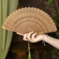 Natural green sandalwood folding fan, vintage hollow carved wooden fan with green tassel. - Lotus Rhyme Green Sandalwood