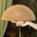 Natural green sandalwood folding fan with tassel, traditional Chinese style Hanfu accessory. - Autumn Crops Green Sandalwood