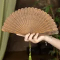 Handheld natural green sandalwood folding fan, vintage carved wooden fan for Chinese Hanfu gift. - Sparse Plum Green Sandalwood