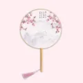 Traditional Chinese round hand fan with wooden handle, pink peach blossom and ink art design. - Peaches in Bloom - Wood Handle