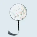 Traditional Chinese round fan with wooden handle and grey tassel for Hanfu photography. - Return of Spring Breeze - Black Handle