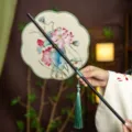 Chinese style bamboo folding waist fan for Hanfu, lotus pattern with tassel, portable. - 8-Petal Green Lotus Waist Fan (Bamboo Edge)