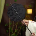 Traditional Chinese style embroidered hand fan with exquisite butterfly pattern and elegant tassel. - 8-Petal Black Butterfly Waist Fan (Bamboo Edge)