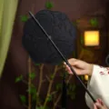 Traditional Chinese black waist fan, vintage embroidered folding fan with tassel design. - 8-Petal Floating Quills Waist Fan (Bamboo Edge)