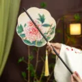 Chinese Hanfu rollable waist fan, peony flower design with bamboo handle and tassel. - 8-Petal Blooming Peony Waist Fan (Bamboo Edge)