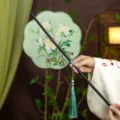 Ancient style bamboo waist fan, exquisite embroidered round fan with green tassel for Hanfu. - 8-Petal Celadon Jade Waist Fan (Bamboo Edge)