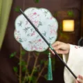Traditional Chinese Hanfu waist fan with bamboo handle, floral fabric pattern and green tassel. - 8-Petal Clear Shadow Waist Fan (Bamboo Edge)