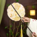 Traditional Chinese round fan with bamboo handle and elegant tassel for Hanfu styling. - Shell Morning Glow Waist Fan (Bamboo Edge)