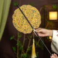 Traditional Chinese style Hanfu round waist fan with bamboo handle and elegant golden tassel decor. - Shell Reciting Poetry Waist Fan (Bamboo Edge)
