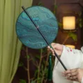 Classical Chinese style round fan with green marbled pattern and tassel for hanfu. - Round Agate River Waist Fan (Bamboo Edge)