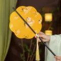 Traditional Chinese style Hanfu round fan with exquisite bamboo handle and gold tassel pendant. - 8-Petal Horse Stepping on Auspicious Clouds Waist Fan - Yellow (Bamboo Edge)