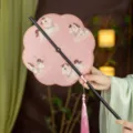 Traditional Chinese style hand fan with pink horse pattern, black bamboo handle, pink tassel. - 8-Petal Horse Stepping on Auspicious Clouds Waist Fan - Pink (Bamboo Edge)
