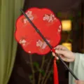 Traditional Hanfu folding waist fan with red fabric, bamboo ribs, and elegant tassel. - 8-Petal Horse Stepping on Auspicious Clouds Waist Fan - Red (Bamboo Edge)