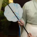 Blue floral Hanfu round fan with black bamboo handle and tassel variant for traditional wear. - 8-Petal Ruoyun Waist Fan (Bamboo Edge)