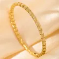 Gold-tone segmented bangle bracelet detail view, showcasing vintage fashion jewelry design. - DQ-2444-3