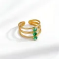 Detailed view of French vintage stainless steel triple-band open ring with green zircon stones. - Open Adjustable / Gold Green Square Stone