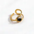 Detailed shot of a vintage gold-plated stainless steel open ring with a black crystal stone. - Open Adjustable / Gold Color Black Zirconia