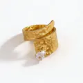 Close-up detail of the gold stainless steel hammered wrap ring featuring a sparkling teardrop zirconia. - Open Adjustable / Gold Hammered White Drop Stone