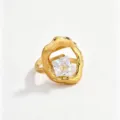 Detailed close-up of the irregular geometric gold ring featuring a sparkling square cubic zirconia. - White Square