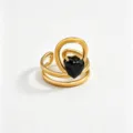 Gold stainless steel ring with black heart zircon, modern minimalist jewelry detail shot. - Black Heart Multi-layer