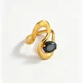 Golden stainless steel wavy open ring for women with a black oval zircon minimalist chic design - Black Waves