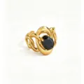 Detailed view of the gold-tone openwork stainless ring featuring a black faceted oval zircon stone. - Black Intertwined
