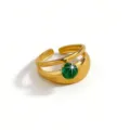 Close-up of a wide open gold-plated ring featuring a sparkling round green zircon stone. - Green Round Rhinestone Style(DQ*3455-2) / Open Adjustable / Gold