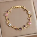 Exquisite gold-plated leaf branch bracelet featuring sparkling colorful cubic zirconia stones. - DQ-W-4091-2