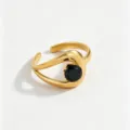 Gold-plated stainless steel open ring with a black cubic zirconia stone, detailed closeup view. - Open Adjustable / Black
