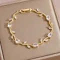 Exquisite gold-plated vine bracelet with sparkling zircon stones, elegant jewelry detail shot. - DQ-W-4092-1
