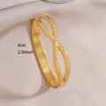 Golden stainless steel geometric open bangle bracelet with 6cm dimension detail for women fashion. - Geometric Cross Open