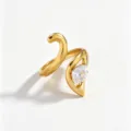 Gold plated stainless steel ring detailed close-up featuring sparkling pear zircon stone. - Open Adjustable / White