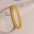 Detail shot of the gold plated stainless steel open bangle, showing the double-row textured design. - Double-Row Geometric Carved