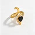 Detailed closeup of an 18k gold plated stainless steel fashion ring featuring a stylish black stone. - Open Adjustable / Black