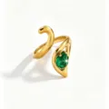 Close-up view of the polished gold stainless steel ring featuring a sparkling green zirconia detail. - Open Adjustable / Green