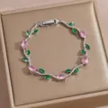 Exquisite zircon vine bracelet with pink oval and green leaf stones, detailed clasp. - DQ-W-4093-5