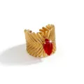 Close-up of a bold gold-plated stainless steel cuff ring featuring a striking marquise red stone. - Open Adjustable / Marquise Geometric Style (DQ-W-3436-4) / Red