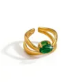 Close-up detail of the elegant gold-plated open ring featuring a sparkling green zircon stone. - Multi-layer Oval Style (DQ-W-3437-2)