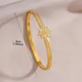 Gold metal bangle bracelet with sparkling crystal star motif and elegant luxury design detail. - 3D Star Rhinestone