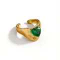 Detailed closeup shot of a gold plated stainless steel green heart cubic zirconia ring - Heart Style (DQ-W-3438-4)
