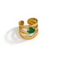 Close-up of a multi-layer gold plated stainless steel ring featuring a sparkling green zircon stone. - Multi-layer Green Stone Style (DQ-W-3439-4)