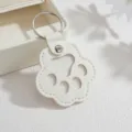 Weißer Leder Katzenpfote Schlüsselanhänger Detail, niedlicher Anhänger mit Ring. - Weiß