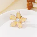 Close-up of enamel flower brooch detail, featuring gradient yellow petals and crystal center. - Yellow (XZ027)