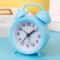 Small blue twin-bell alarm clock, silent quartz desk clock for bedroom and kids room decor. - Blue