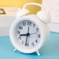 White minimalist twin-bell alarm clock, creative silent pointer desktop clock for bedroom. - White