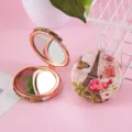 Portable double-sided makeup mirror with vintage Eiffel tower pattern and rose gold frame. - Yellow Butterfly