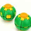 Close-up detail of the colorful 3D printed stress relief puzzle ball with rotating parts. - Green