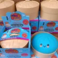 Giant squishy dumpling fidget toy with steamer basket box for detailed presentation. - Blue