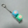 Cute cat paw decompression keycap keychain with dual transparent switch tester for fun stress relief. - 2-Key Transparent Shell Silicone Cat Paw (Blue/Green) with Snake Chain - No Light